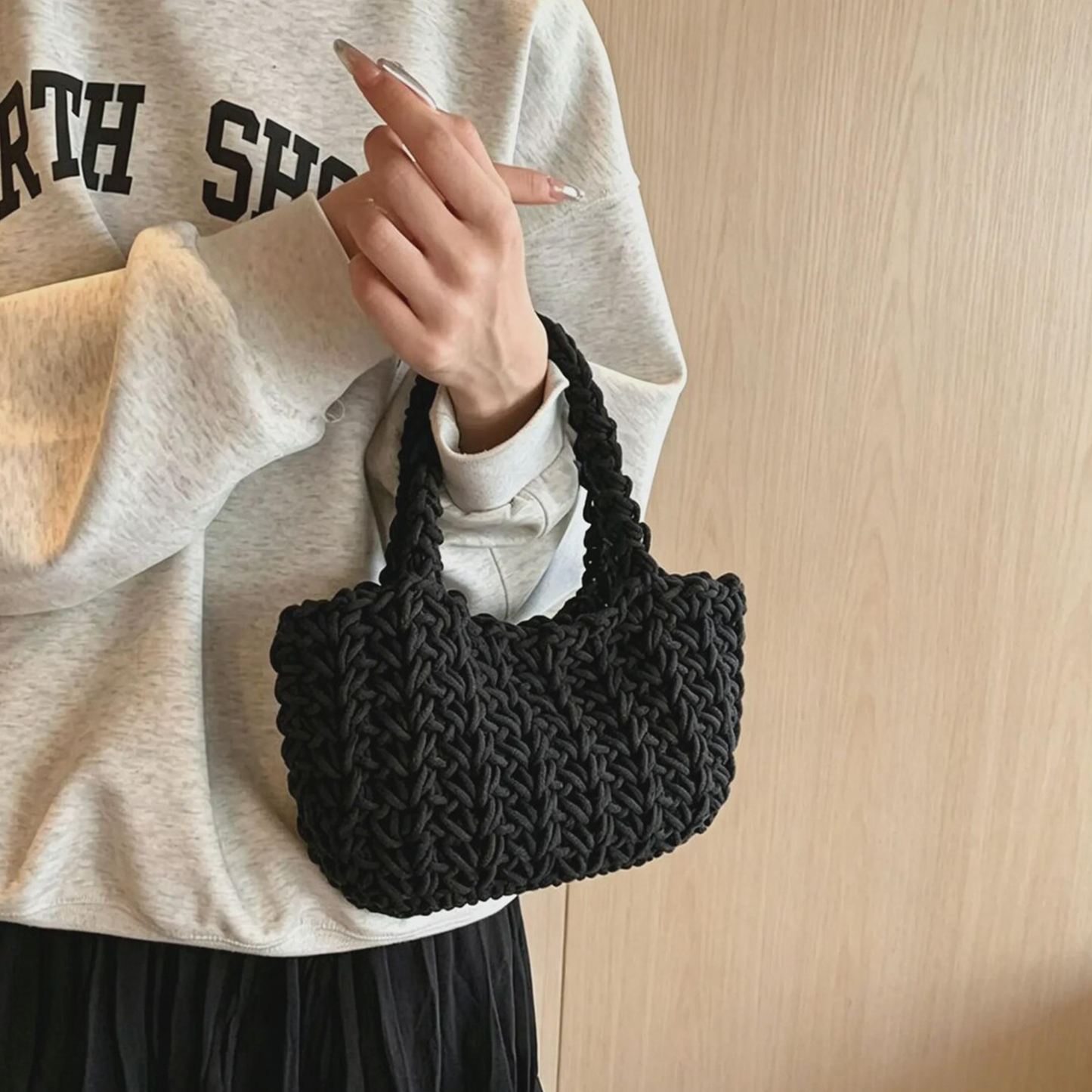 Solid Black Chunky Knit Woven Mini Tote With Integrated Looped Fabric Top Handle, Compact Rounded Inner Storage Cavity And Lightweight Streamlined Silhouette