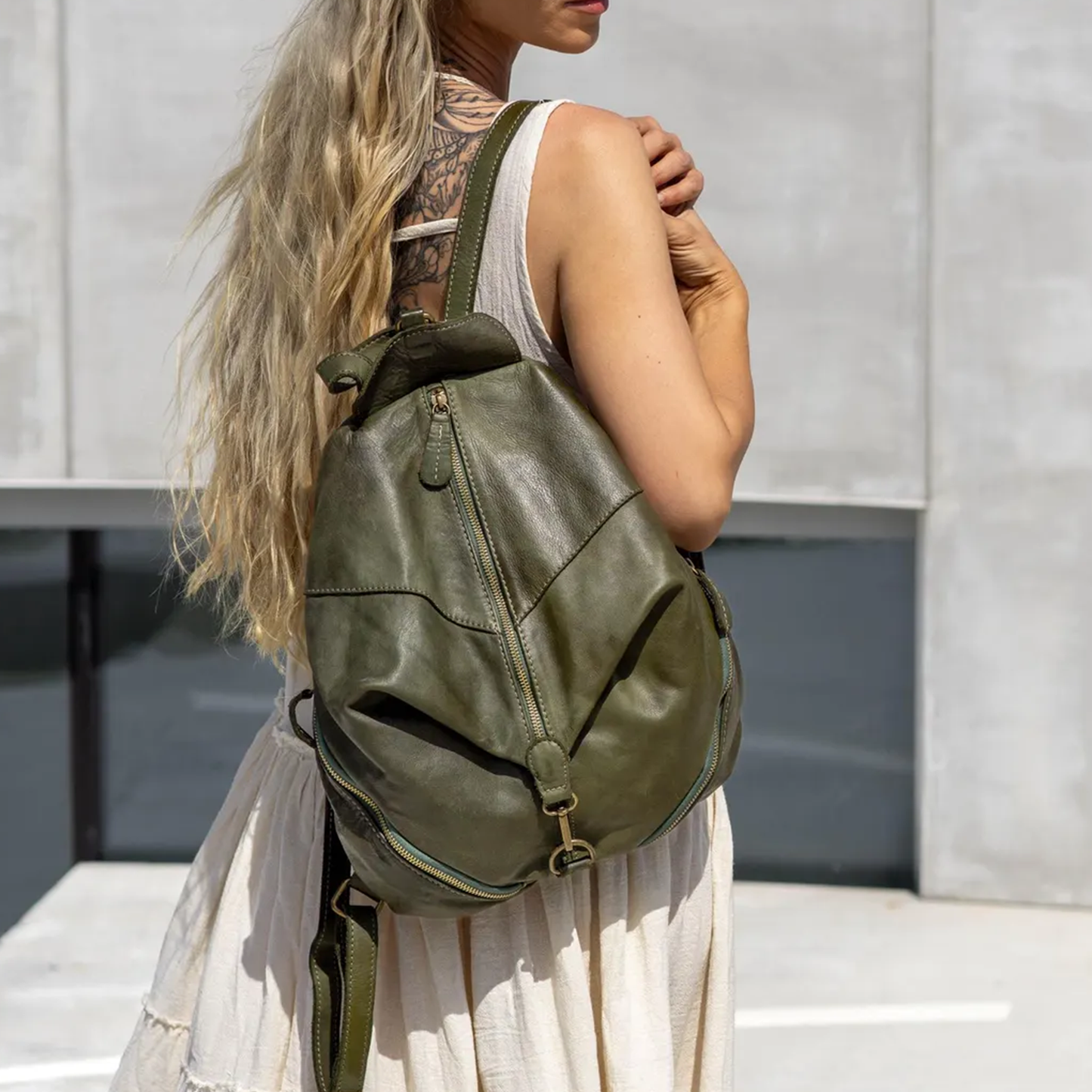 Deep Olive Green Unstructured Teardrop Rucksack With Dual Vertical Zipper Tracks, Antique Metal Ring Hardware And Wide Matching Back Support Straps