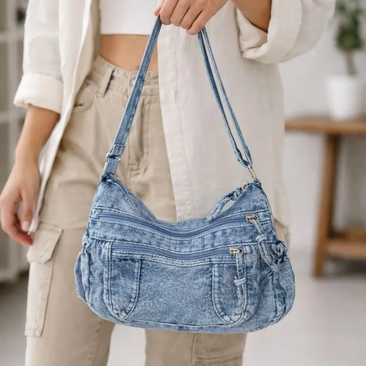 Faded Light Wash Blue Textured Hobo Handbag With Dual Front Zipper Compartments, Stitched Patch Pockets And Gathered Expandable Side Panels
