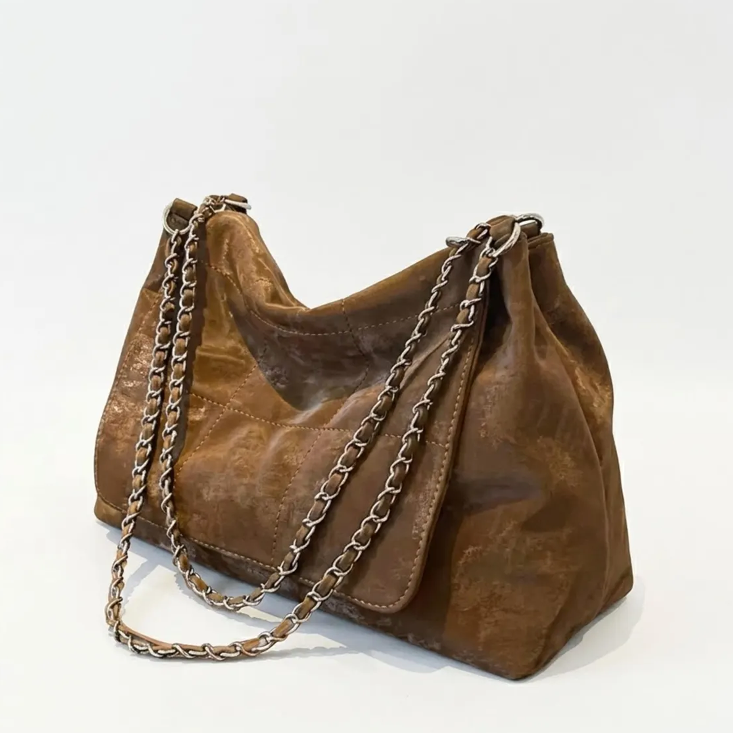 Faded Cocoa Brown Grid Stitch Slouch Shoulder Bag With Dual Interwoven Metal Chain Straps, Layered Front Flap Pocket And Spacious Draped Main Compartment